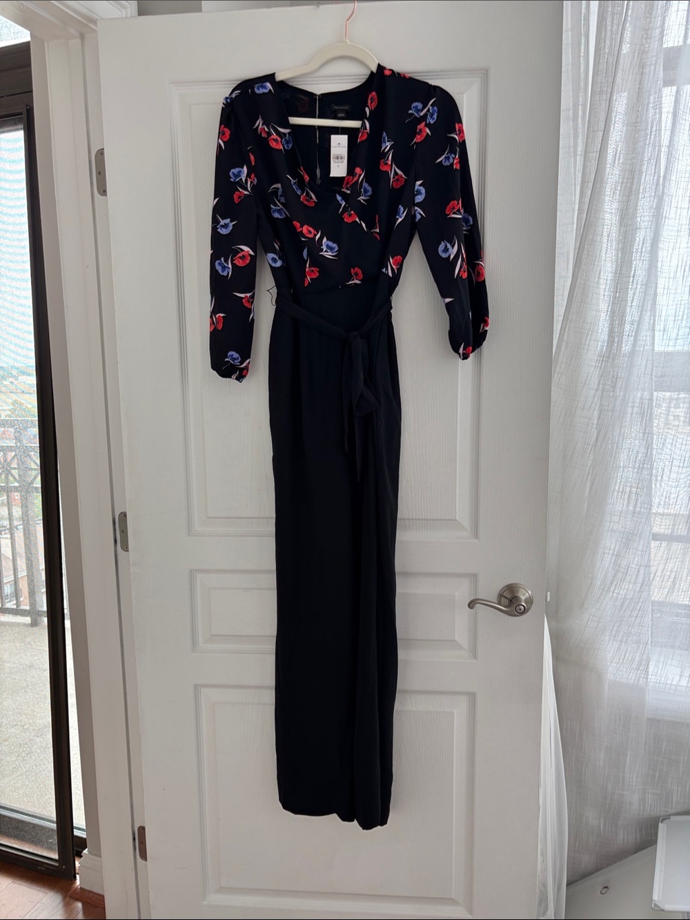 NWT. -Ann Taylor Black Floral Wrap Jumpsuit with Red/Orange and Periwinkle Print